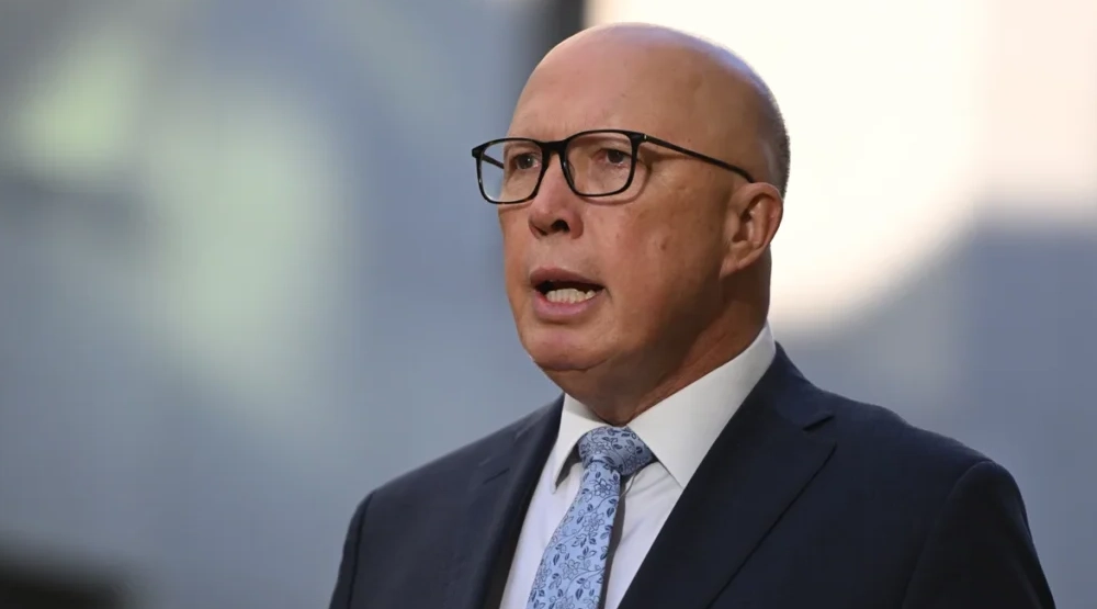 Peter Dutton standing outside Parliament House, symbolizing political power and wealth — a visual representation of Peter Dutton Net Worth.